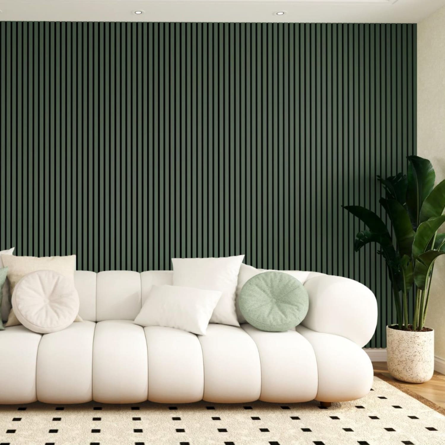 A plush white sofa with rounded cushions against a dark green slatted accent wall.