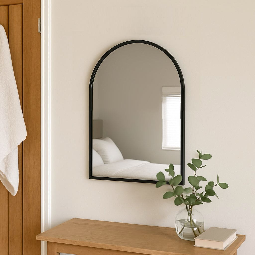 Black framed arched mirror.