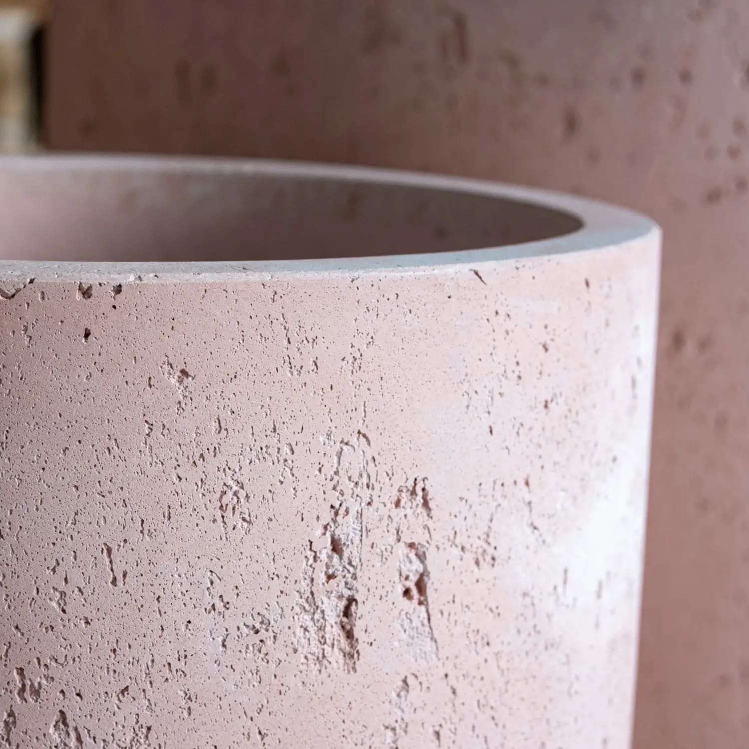 Textured pink concrete planter.