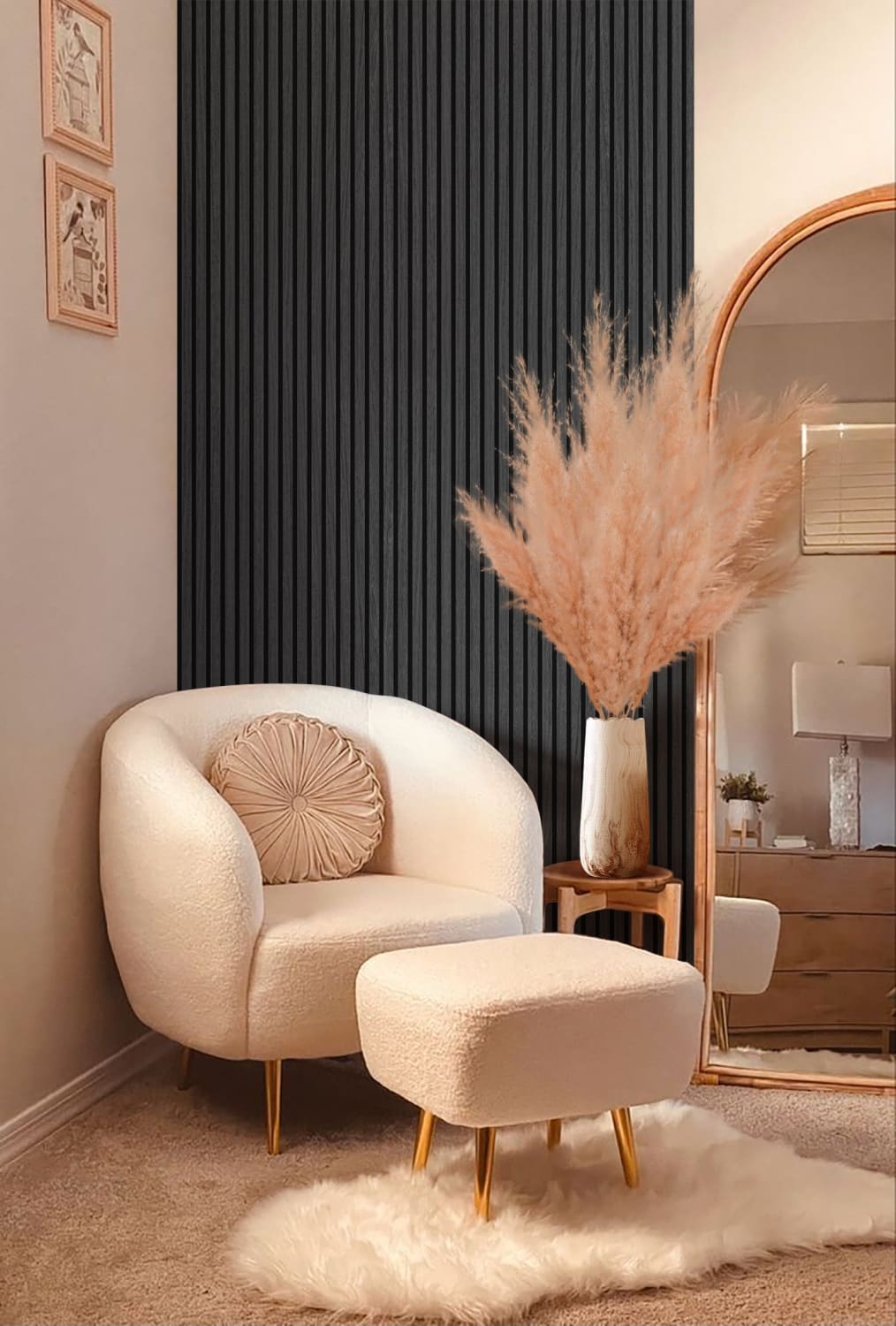 Cream-colored barrel chair with matching ottoman and round decorative pillow.