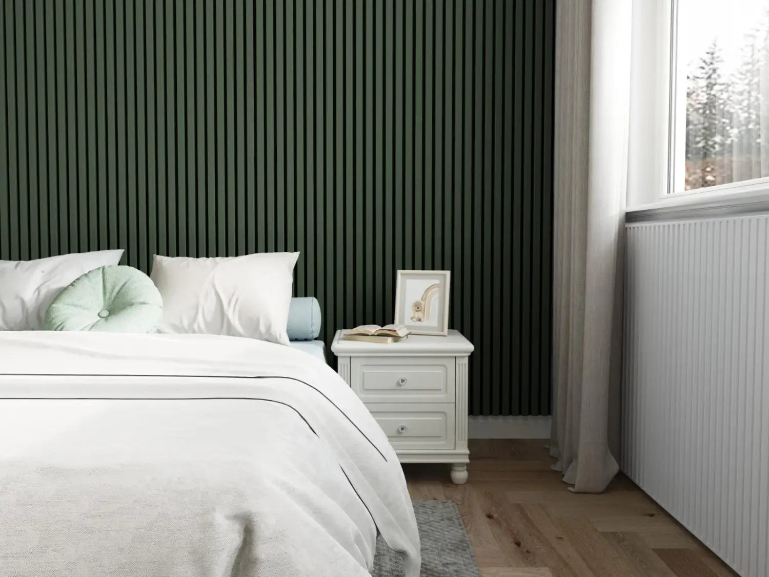 A bed with white bedding and two pillows against a dark green slatted accent wall.