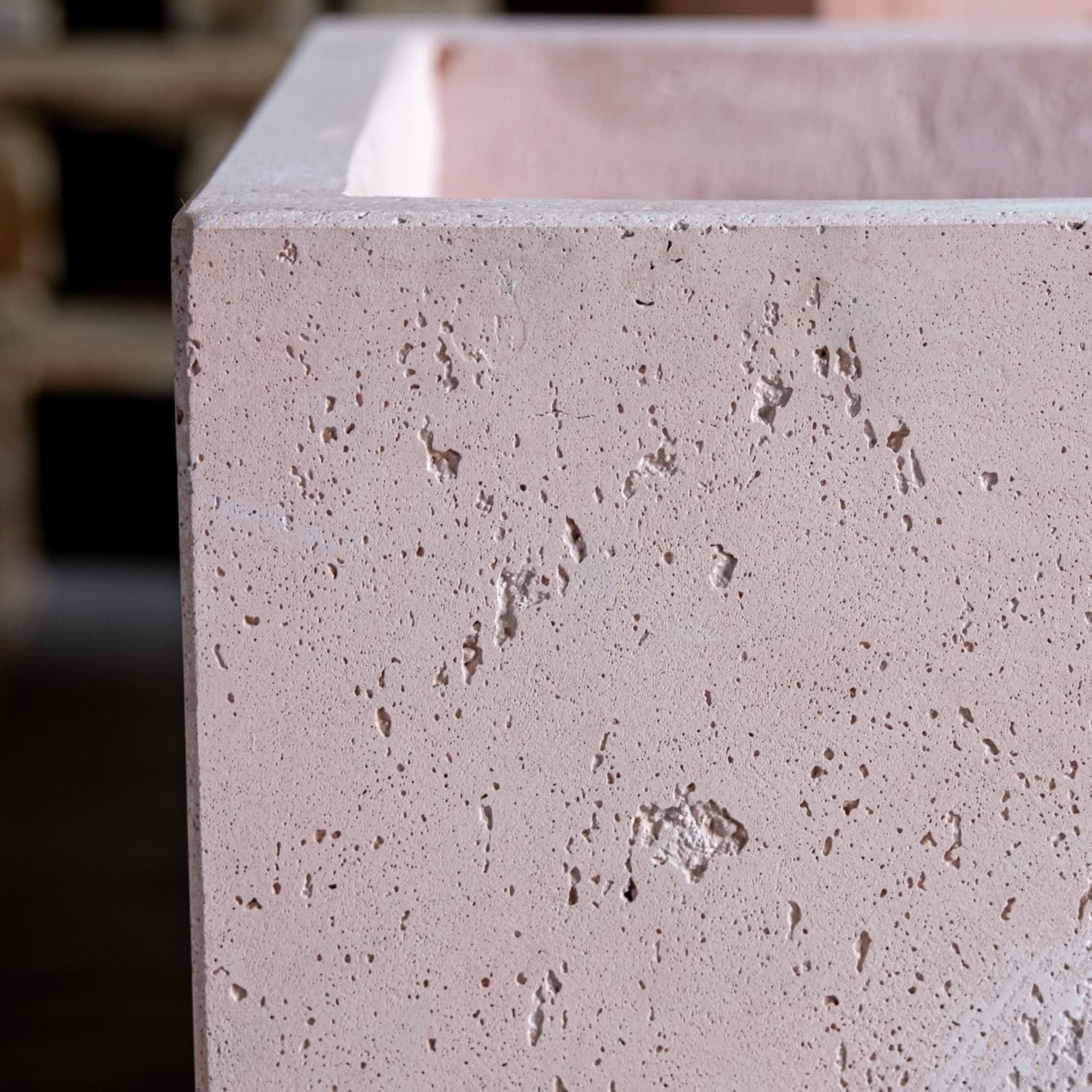 Textured, light pink concrete planter.