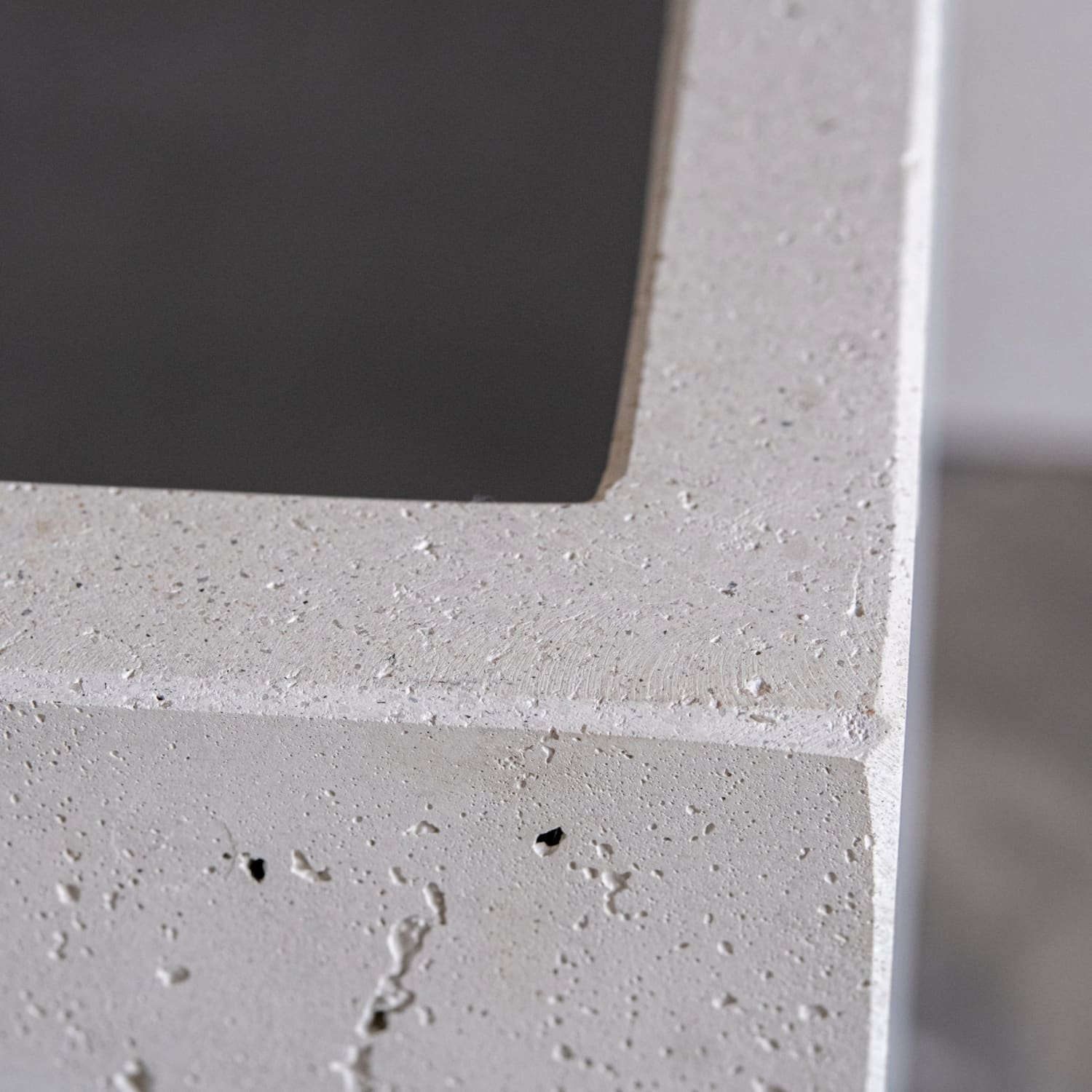 Textured gray concrete planter.