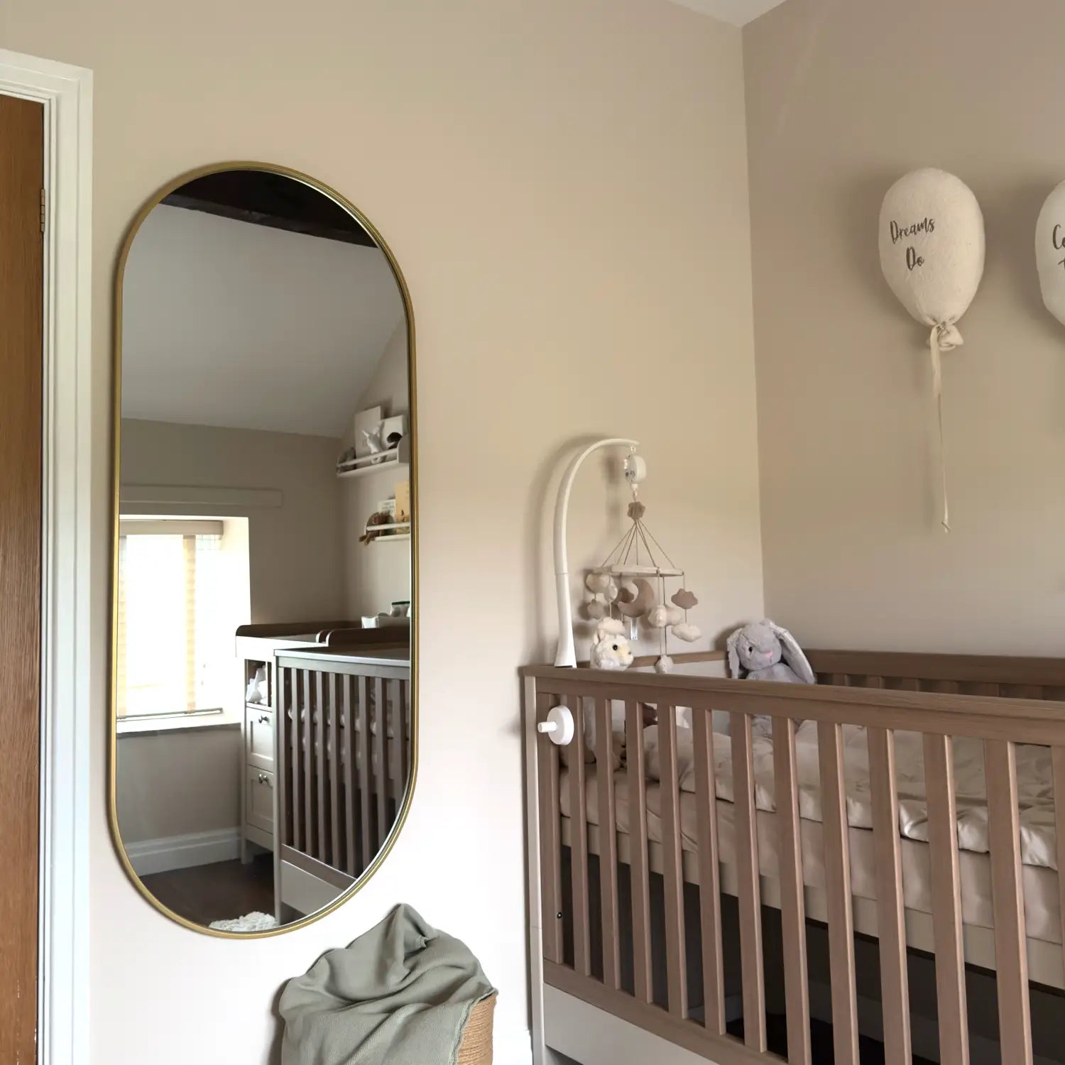 Oval gold-framed mirror.