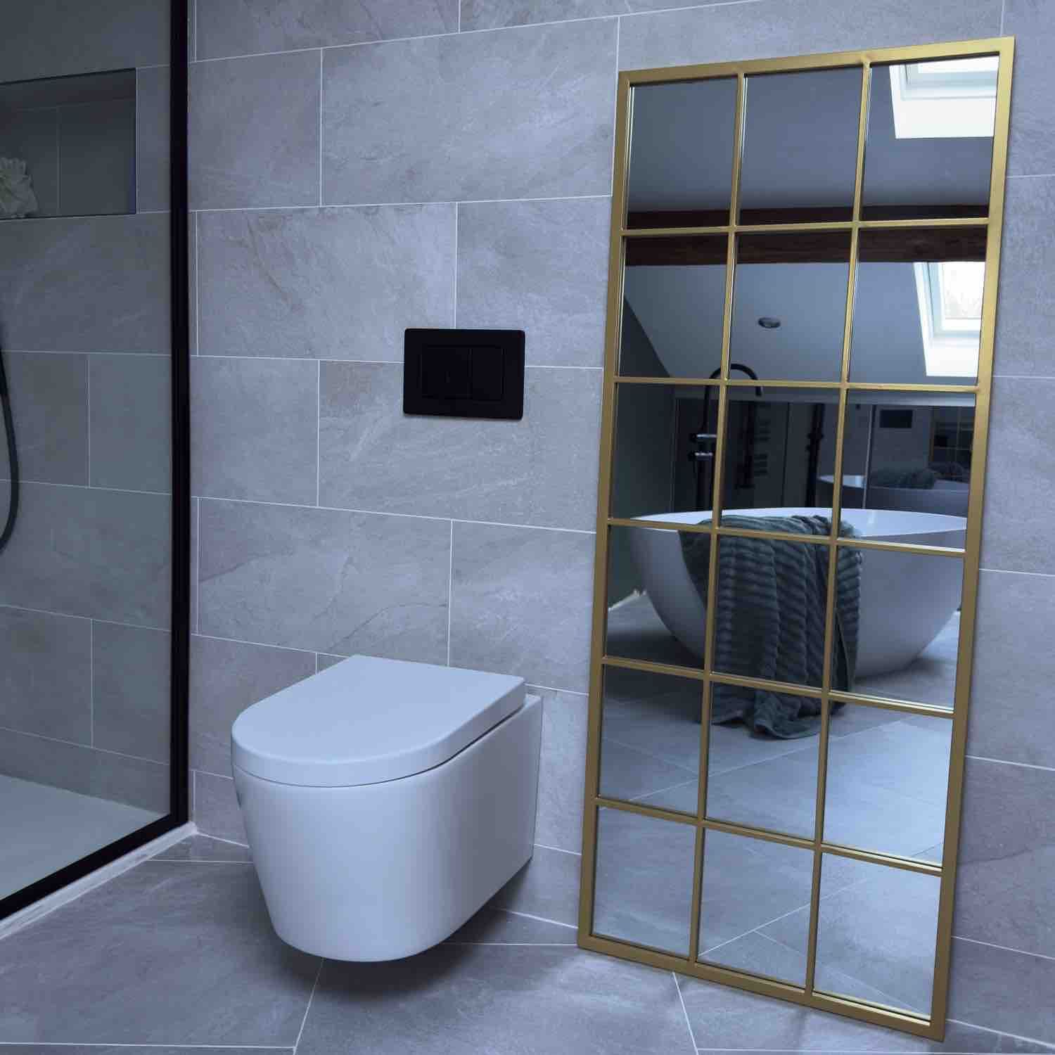 Gold-framed grid mirror.
