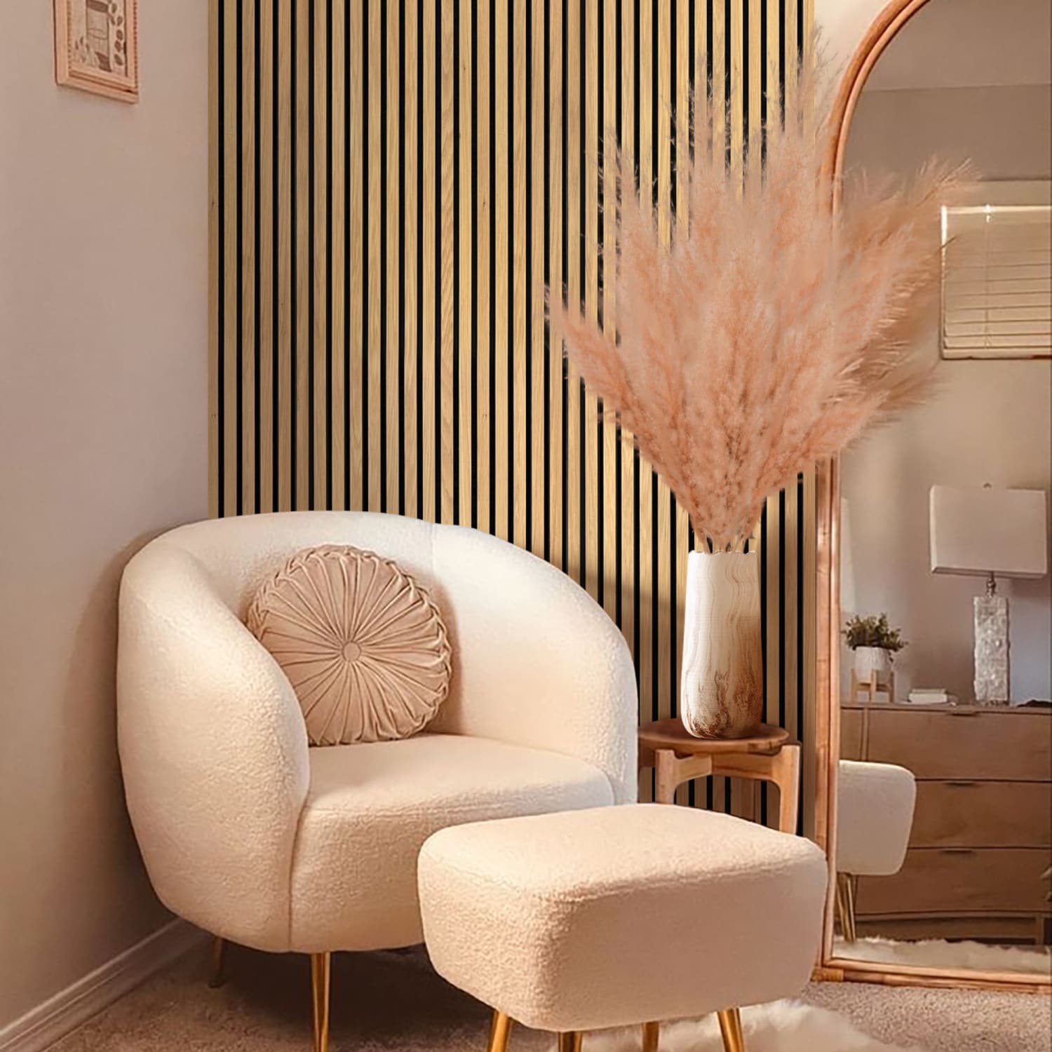 Cream-colored barrel chair with matching ottoman and circular accent pillow.