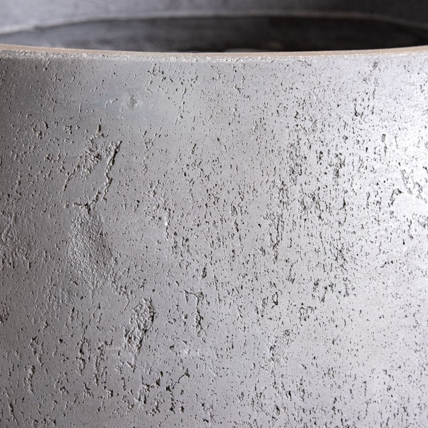 Textured gray concrete planter.