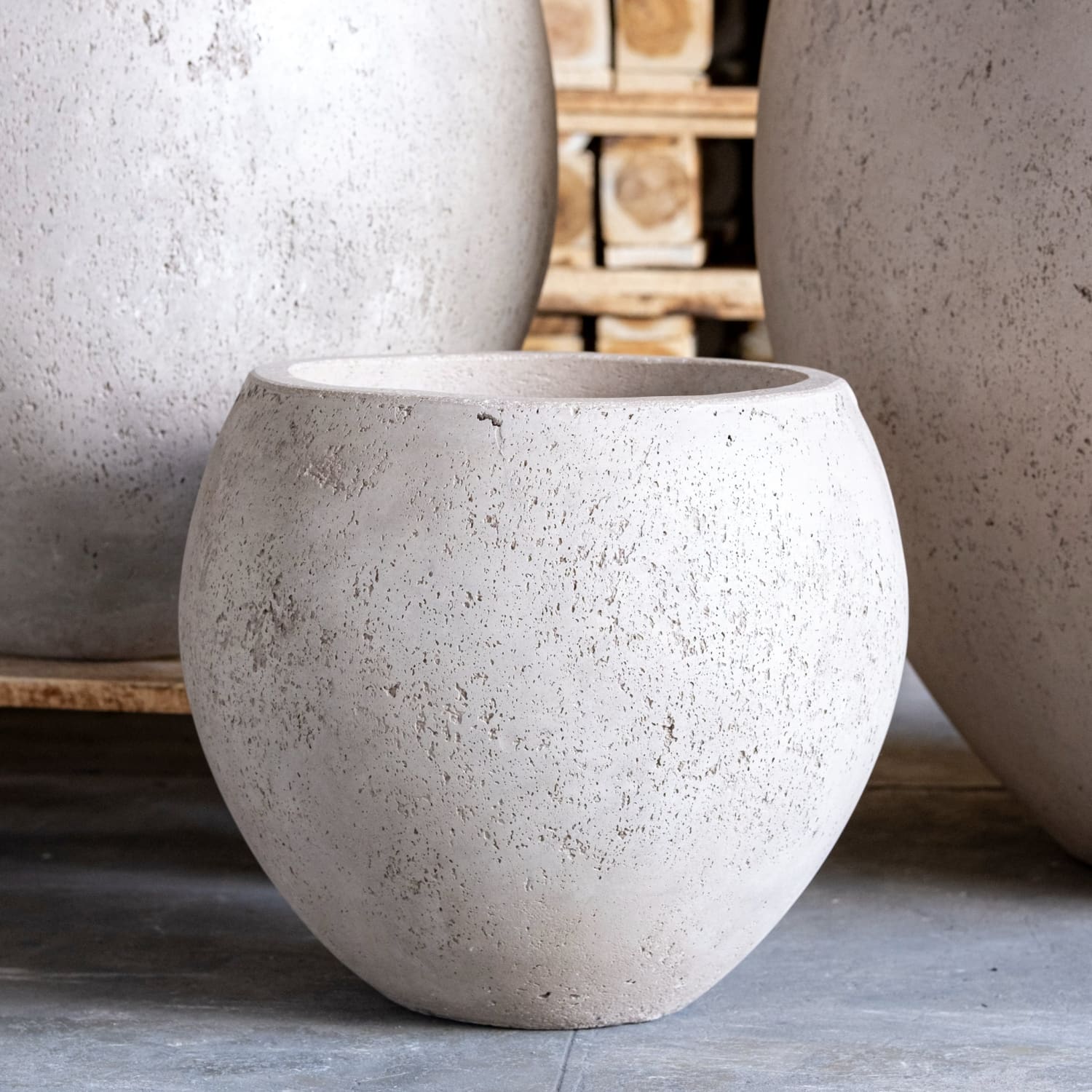 Textured, round, concrete planter.