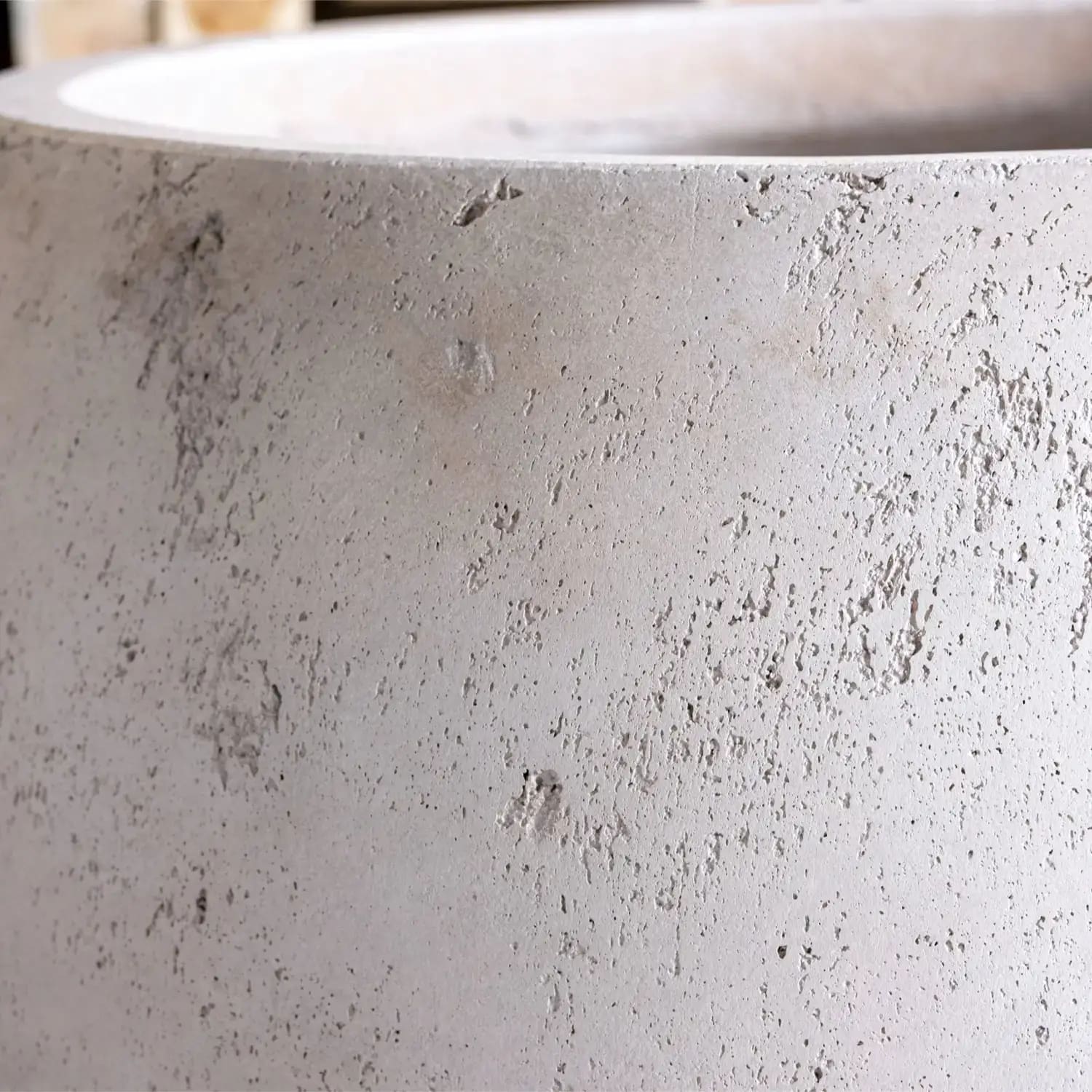 Textured gray concrete planter.