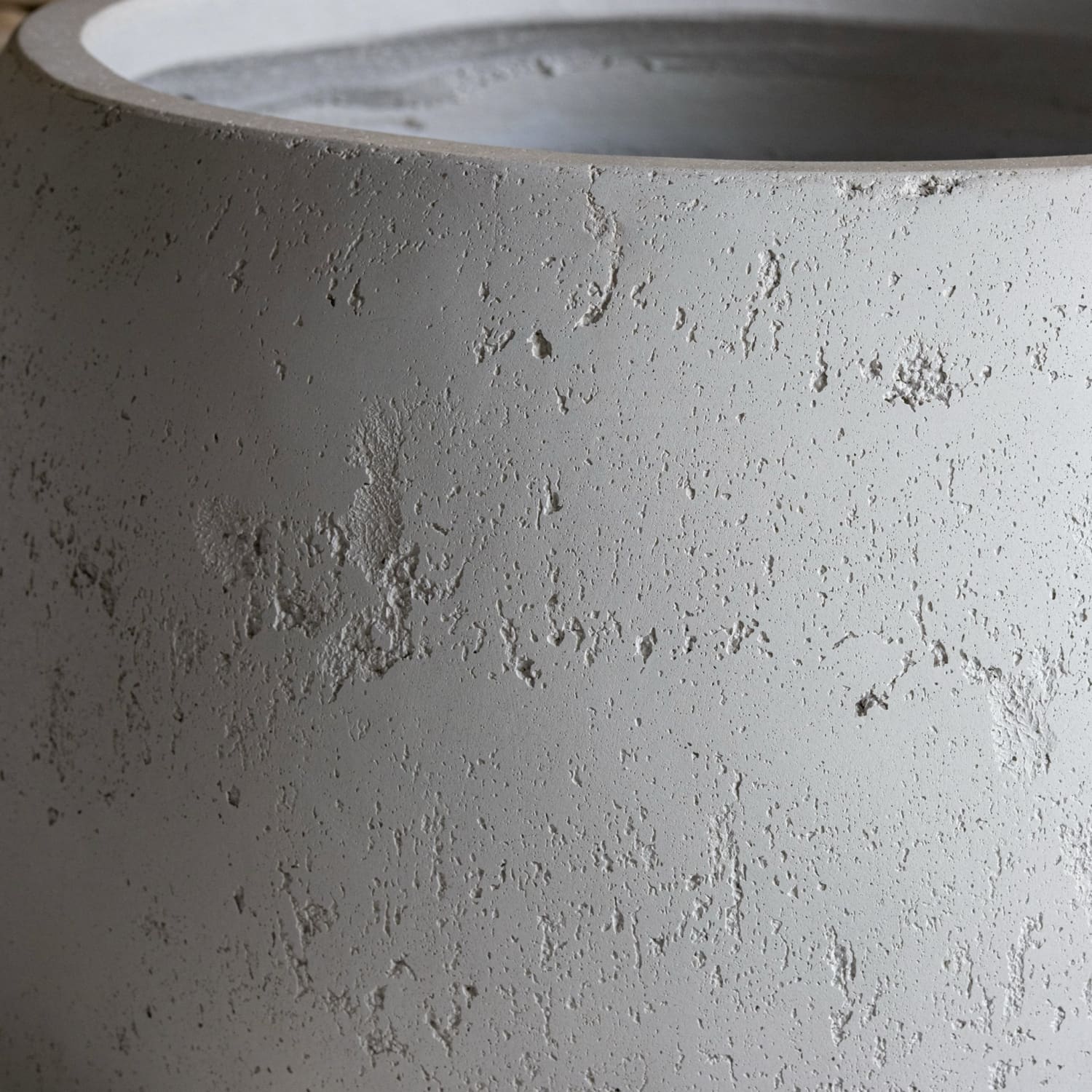 Textured gray concrete planter.