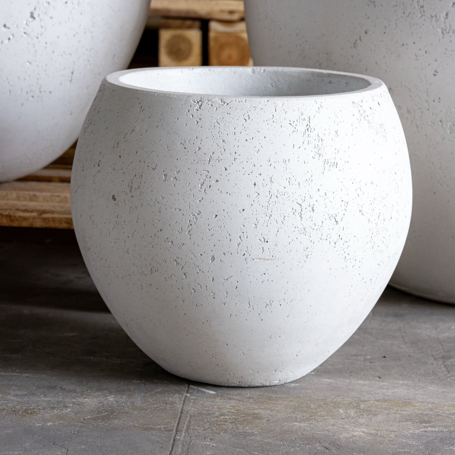 Round, textured, white planter.