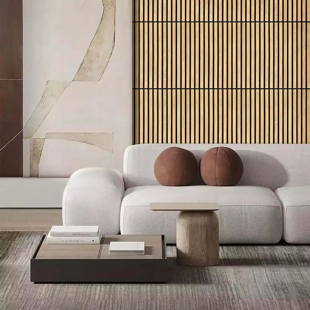 Plush white sofa with rounded edges and two brown circular cushions.