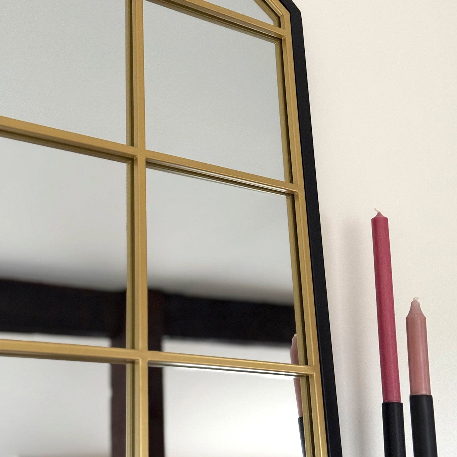 Framed mirror with blue and gold trim.