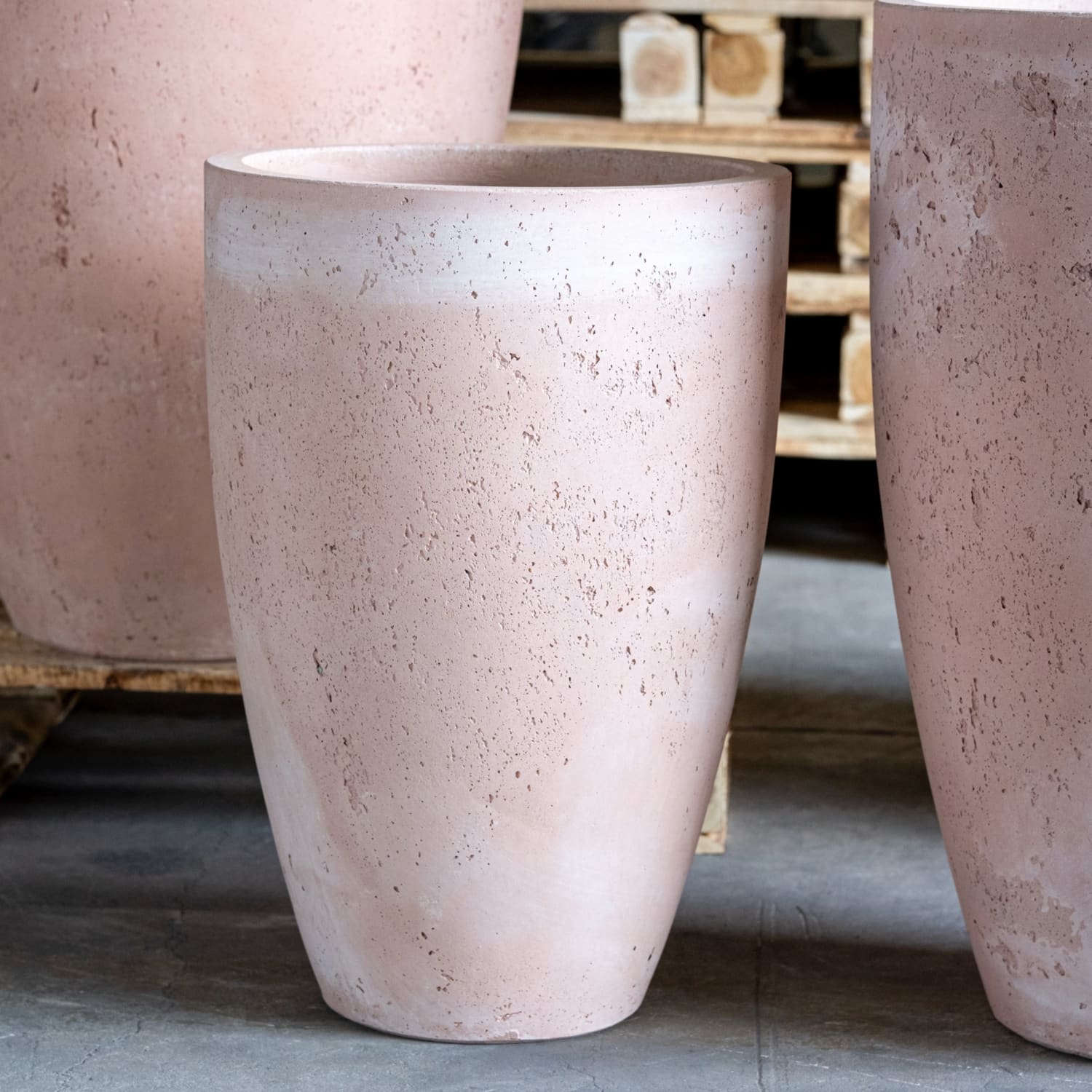 Textured, light pink, cylindrical planter.