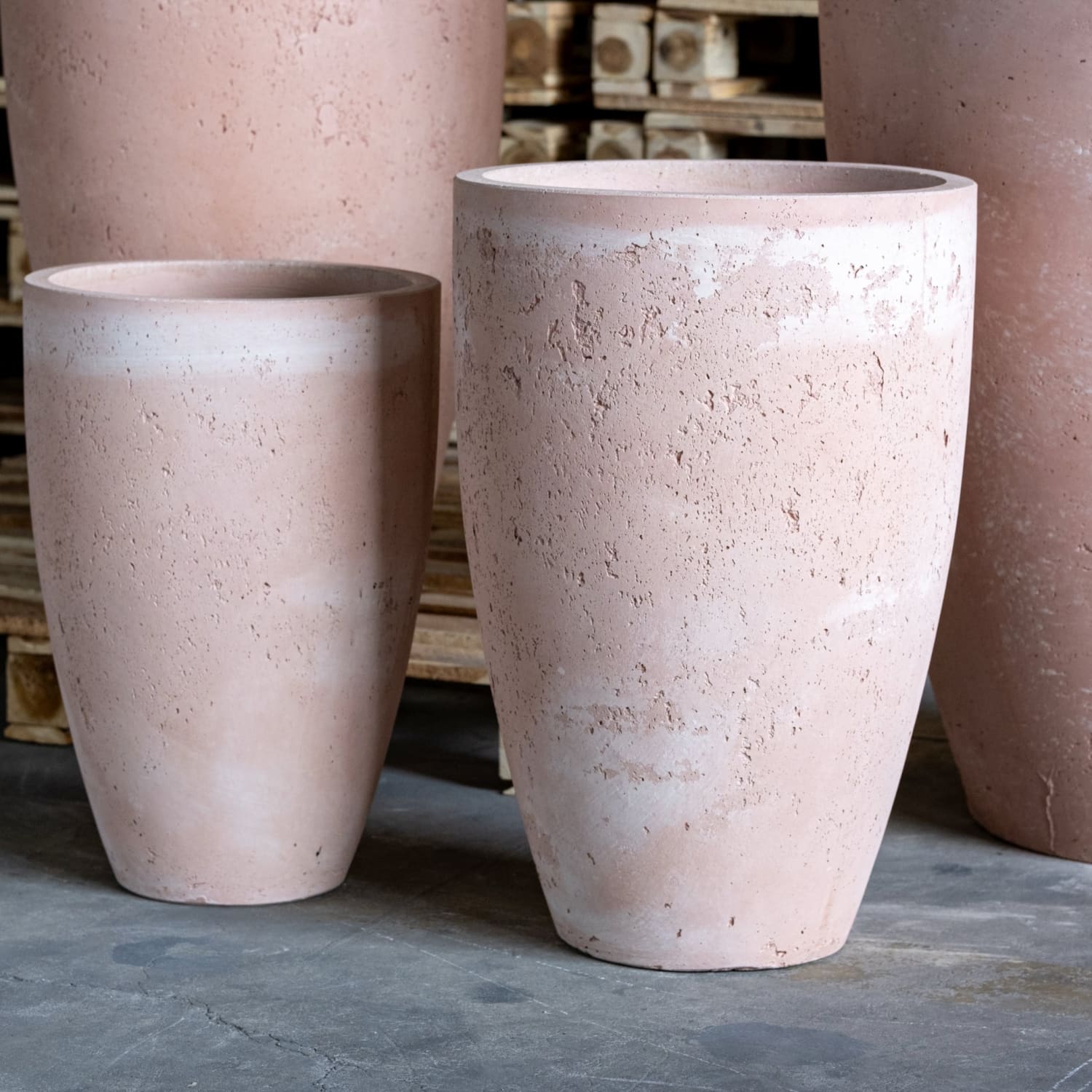 Textured, pinkish-tan, cylindrical planters.