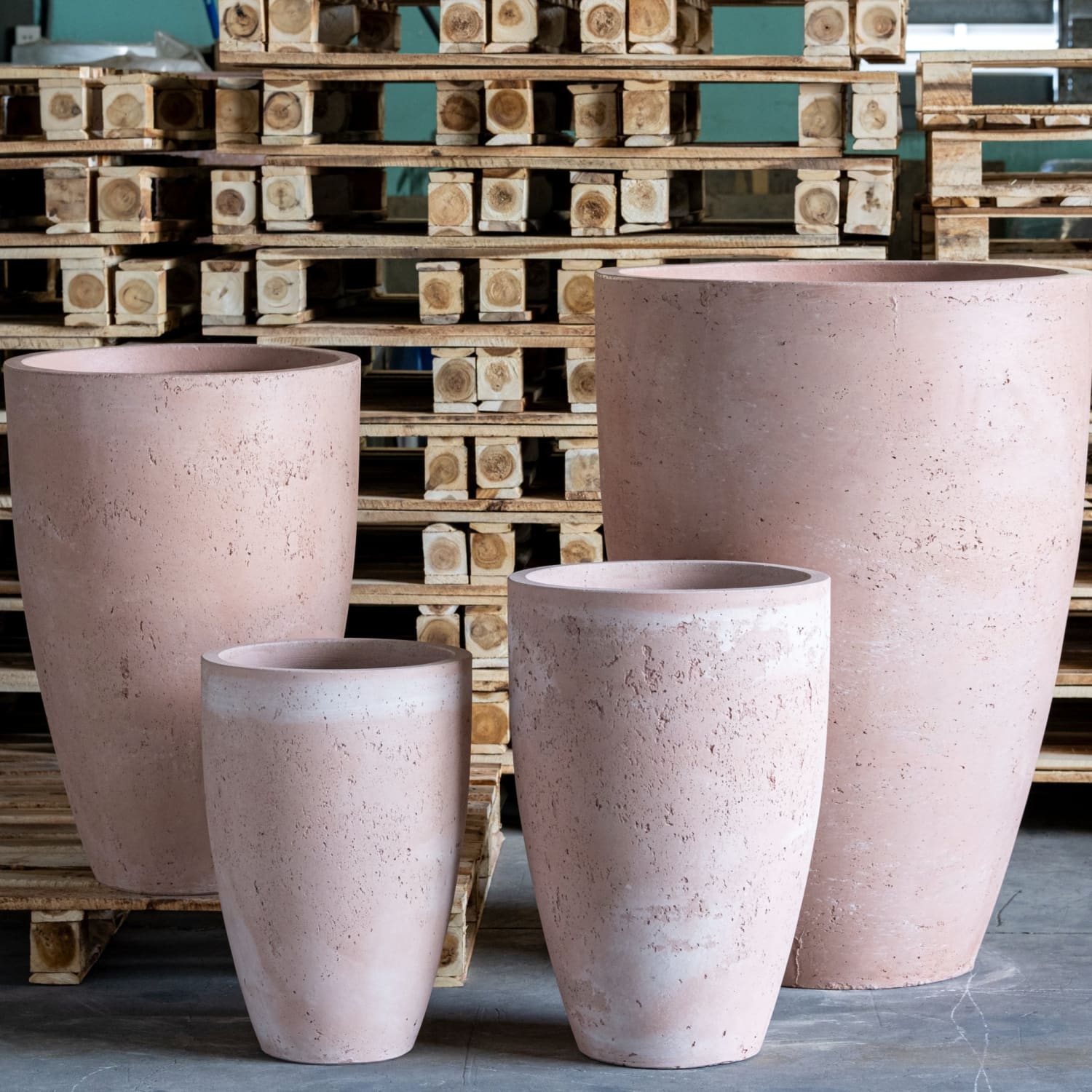 Four pinkish-beige textured planters.