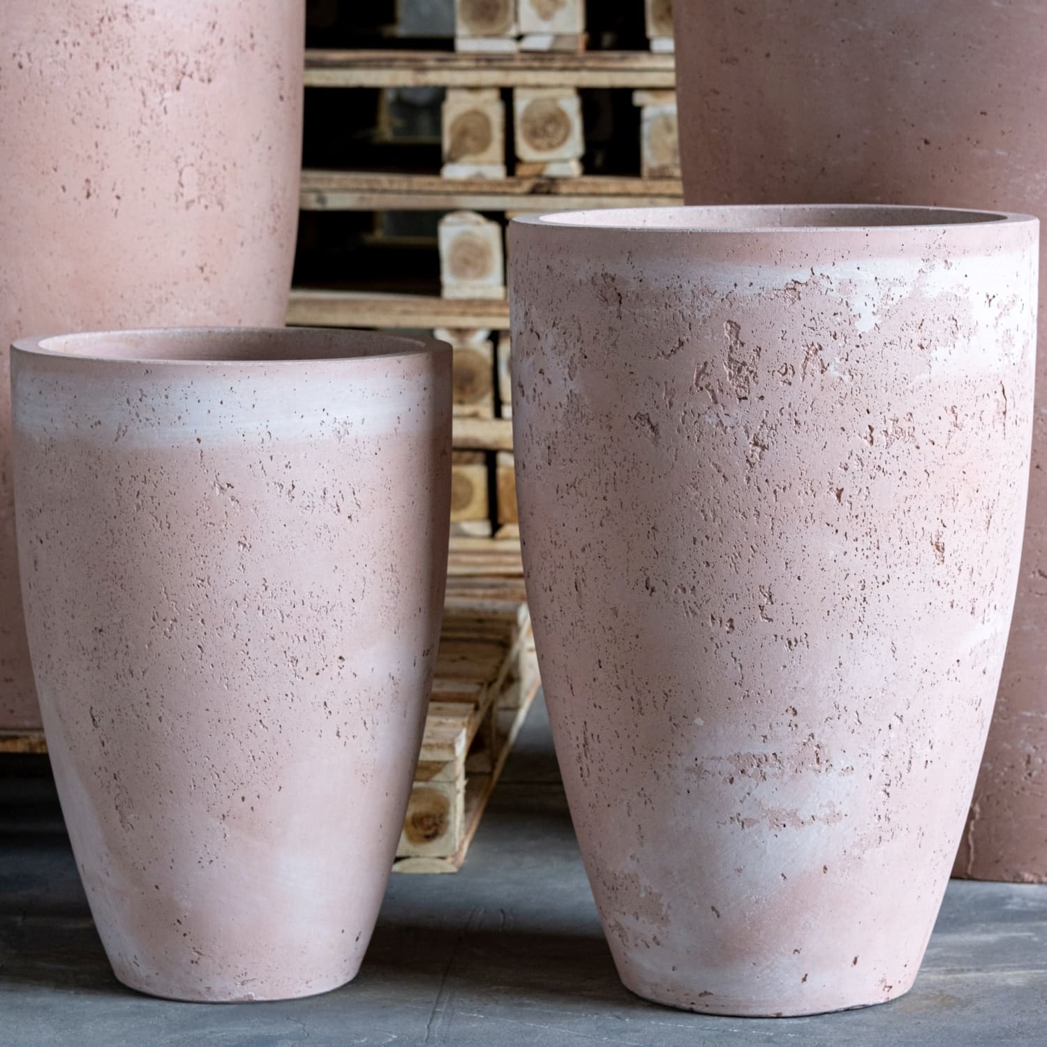 Textured pinkish-tan concrete planters.