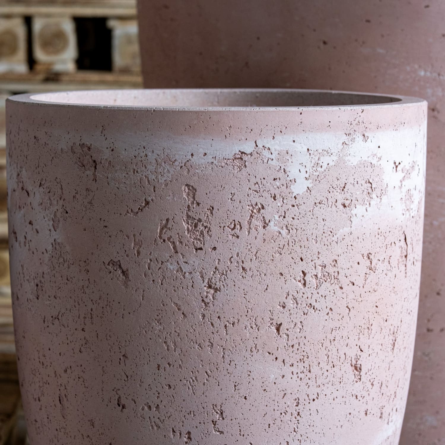 Textured, cylindrical, pinkish-tan planter.