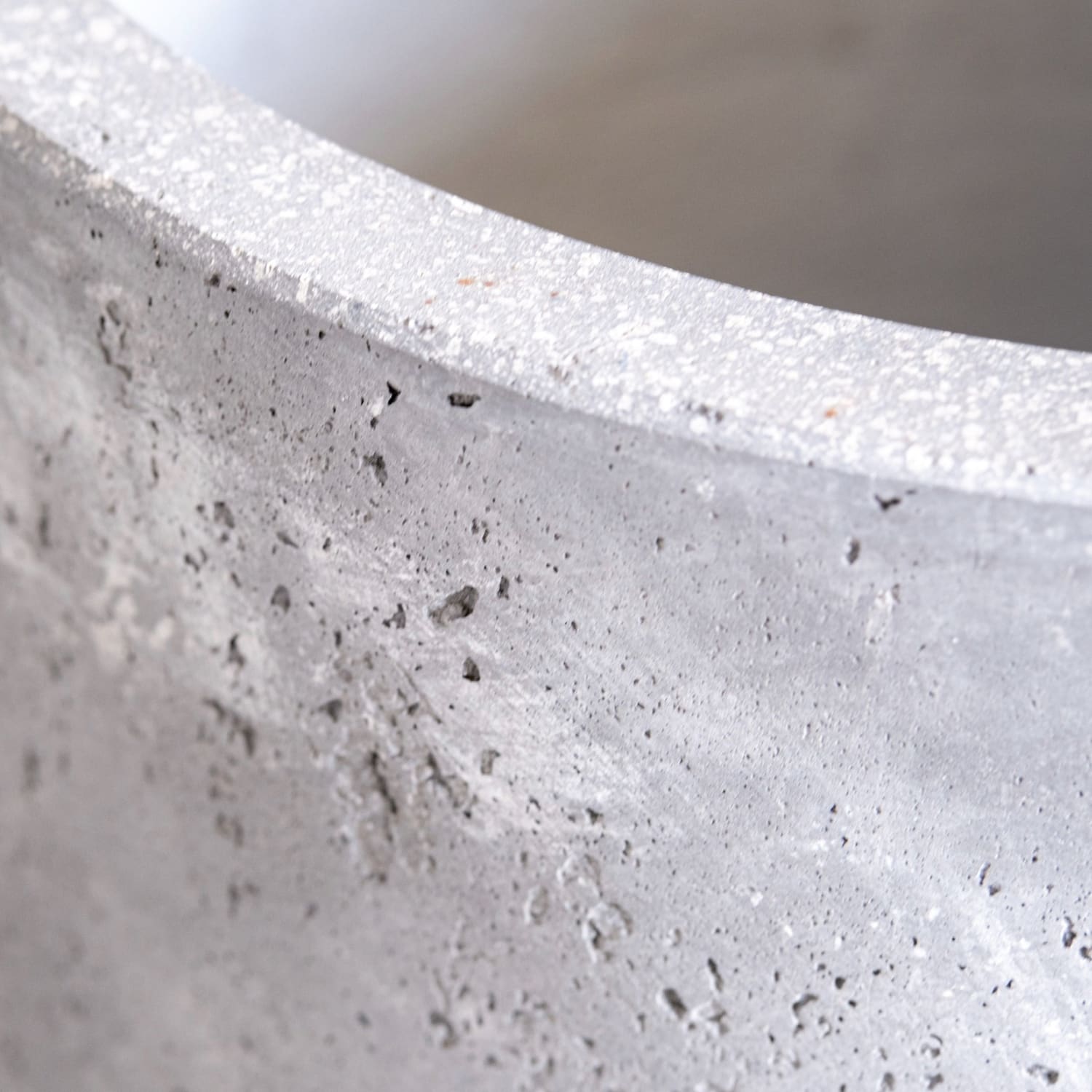 Rough, gray concrete planter.