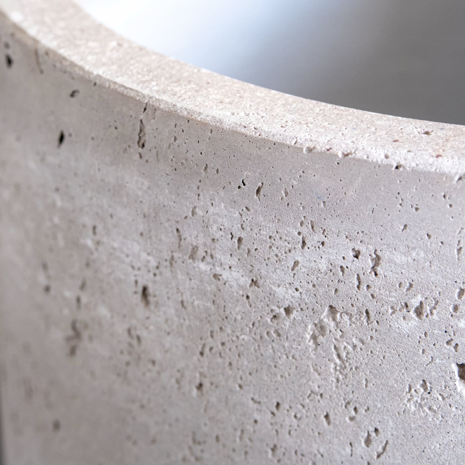 Textured gray concrete planter.