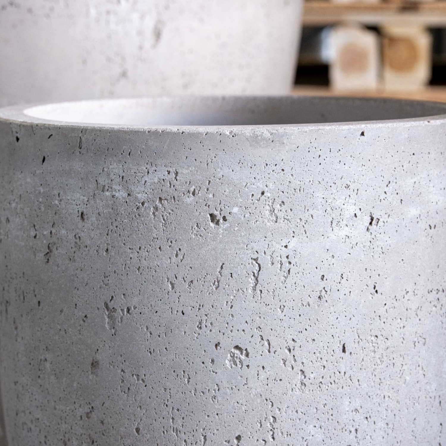 Porous gray concrete planter.