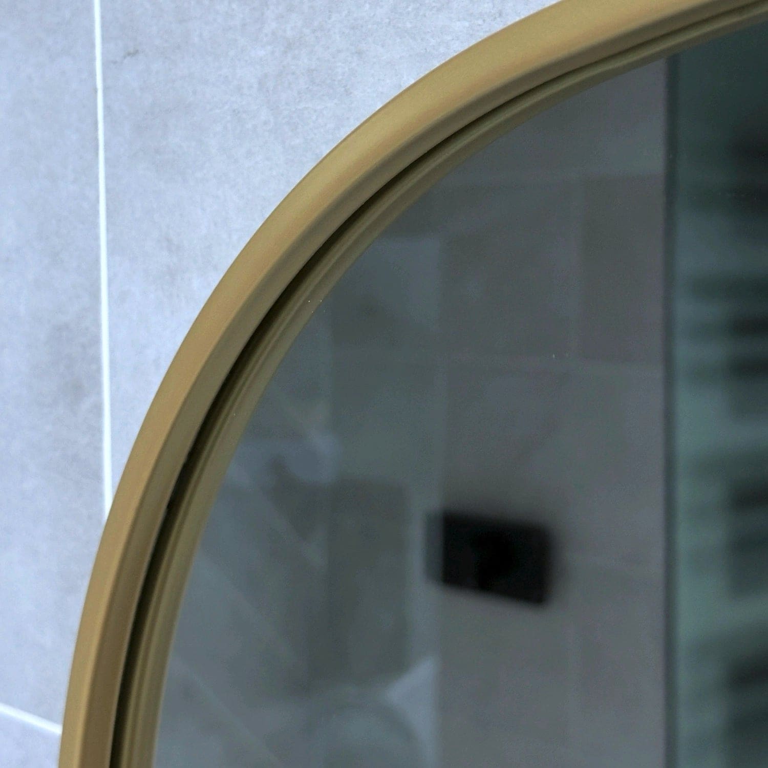 Round mirror with gold frame.