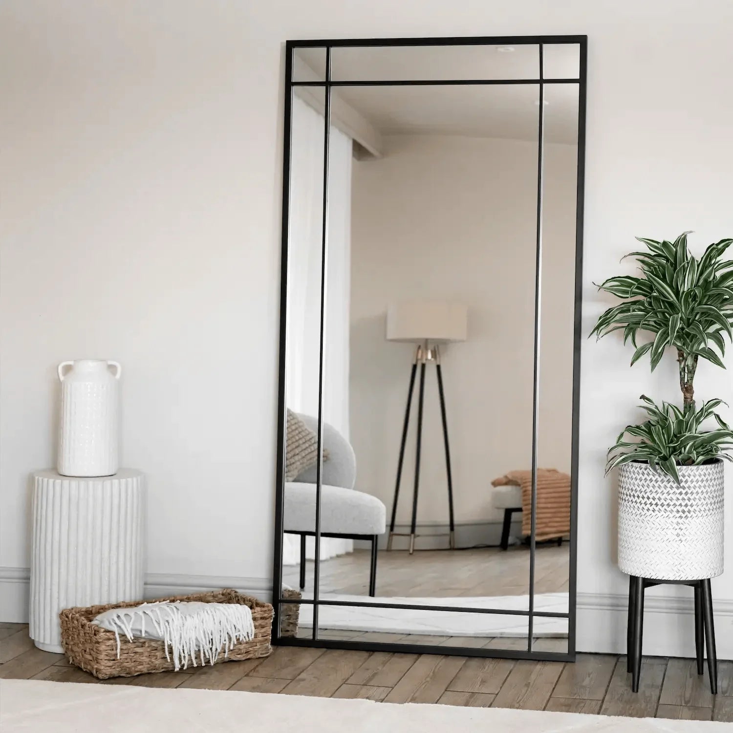 Rectangular black-framed mirror.