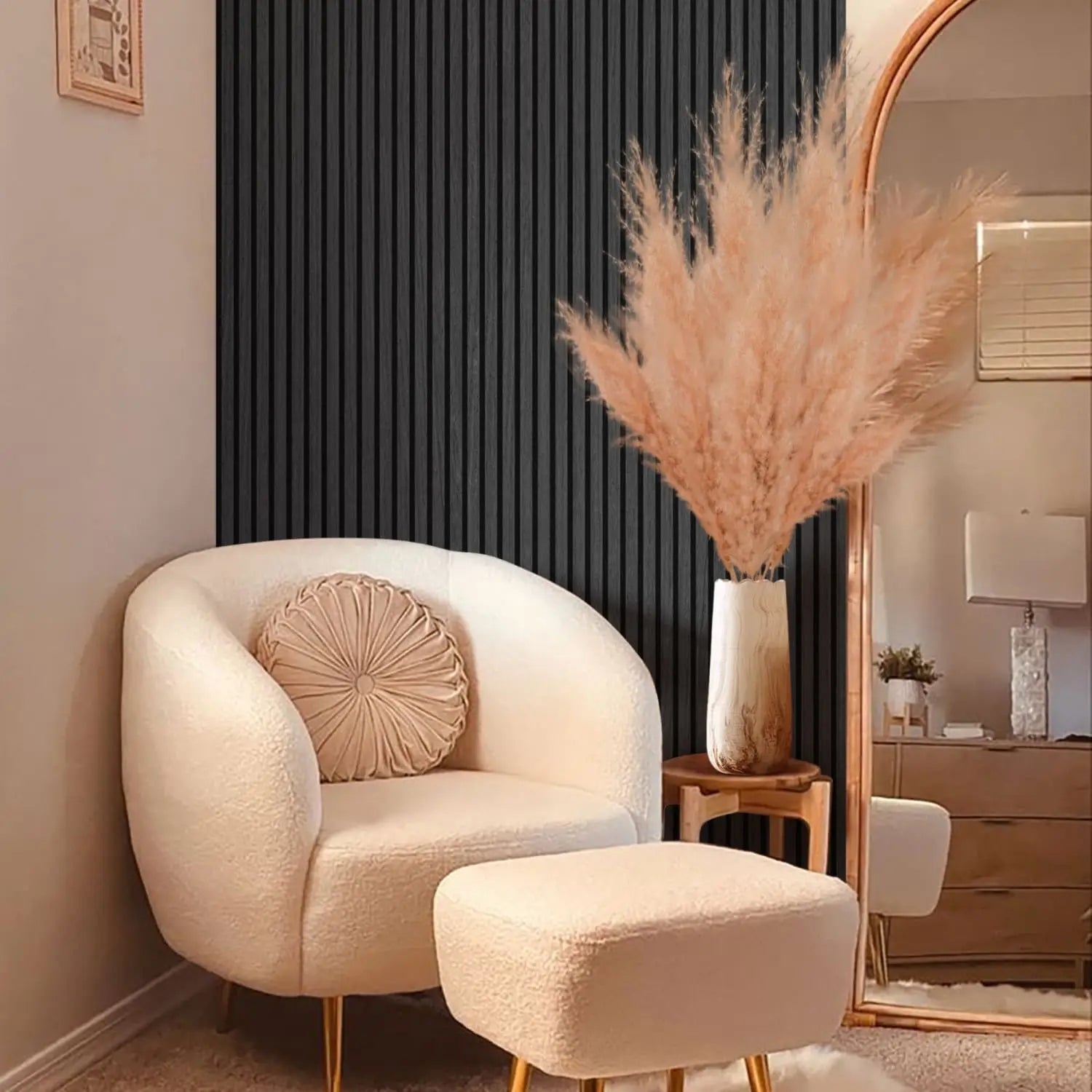Cream-colored bouclé armchair with a matching ottoman.