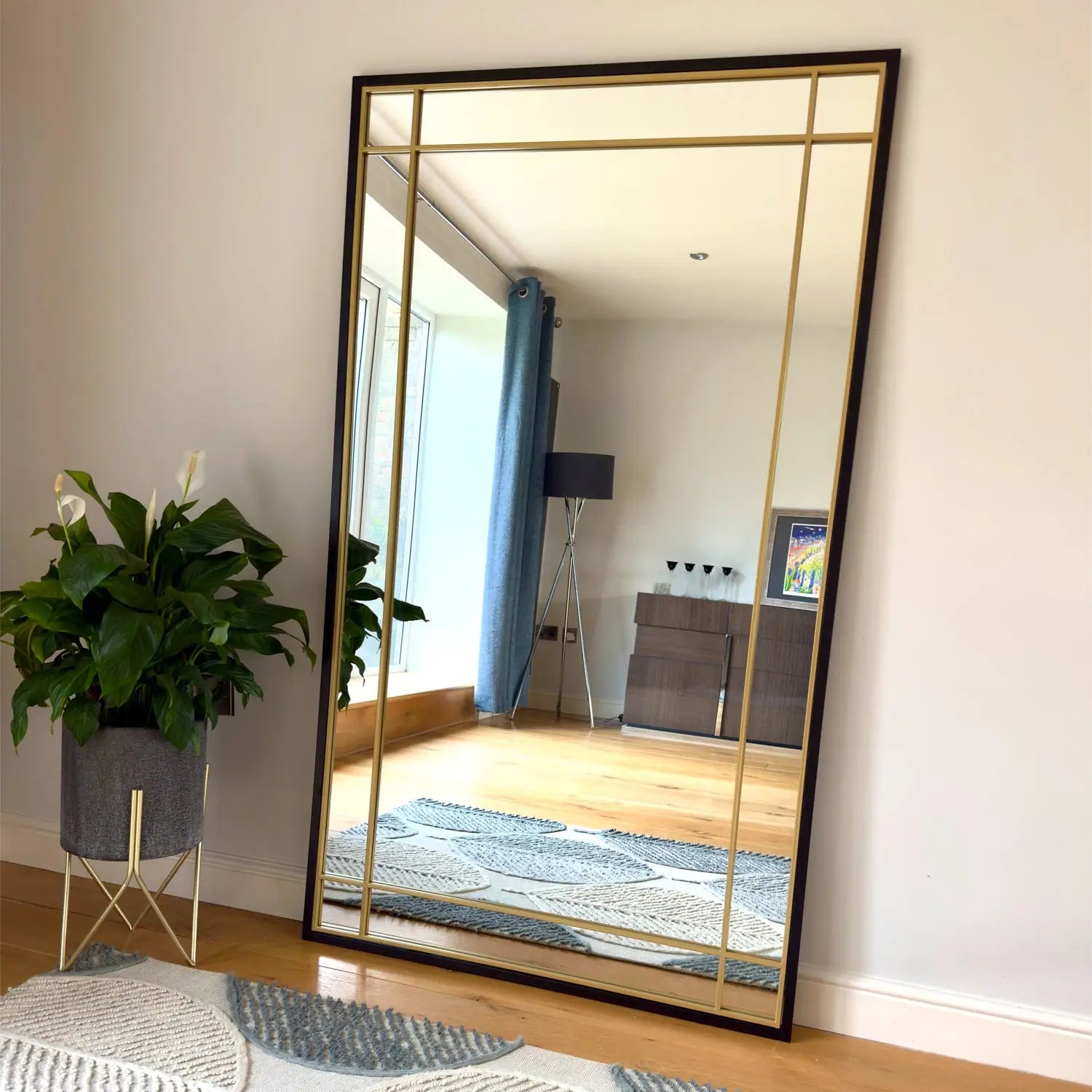 Rectangular mirror with gold accents.