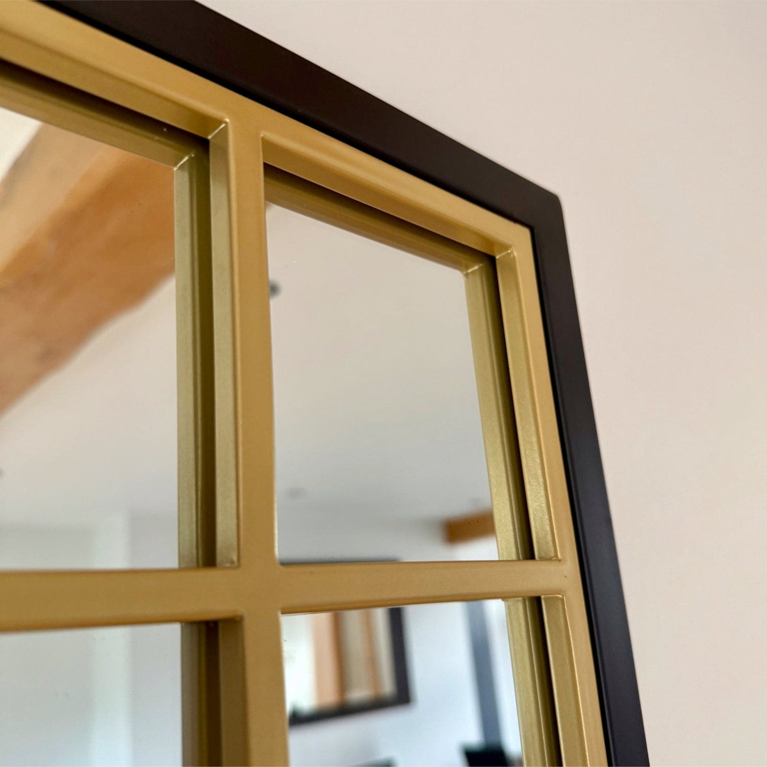 Hexagonal mirror with gold grid.