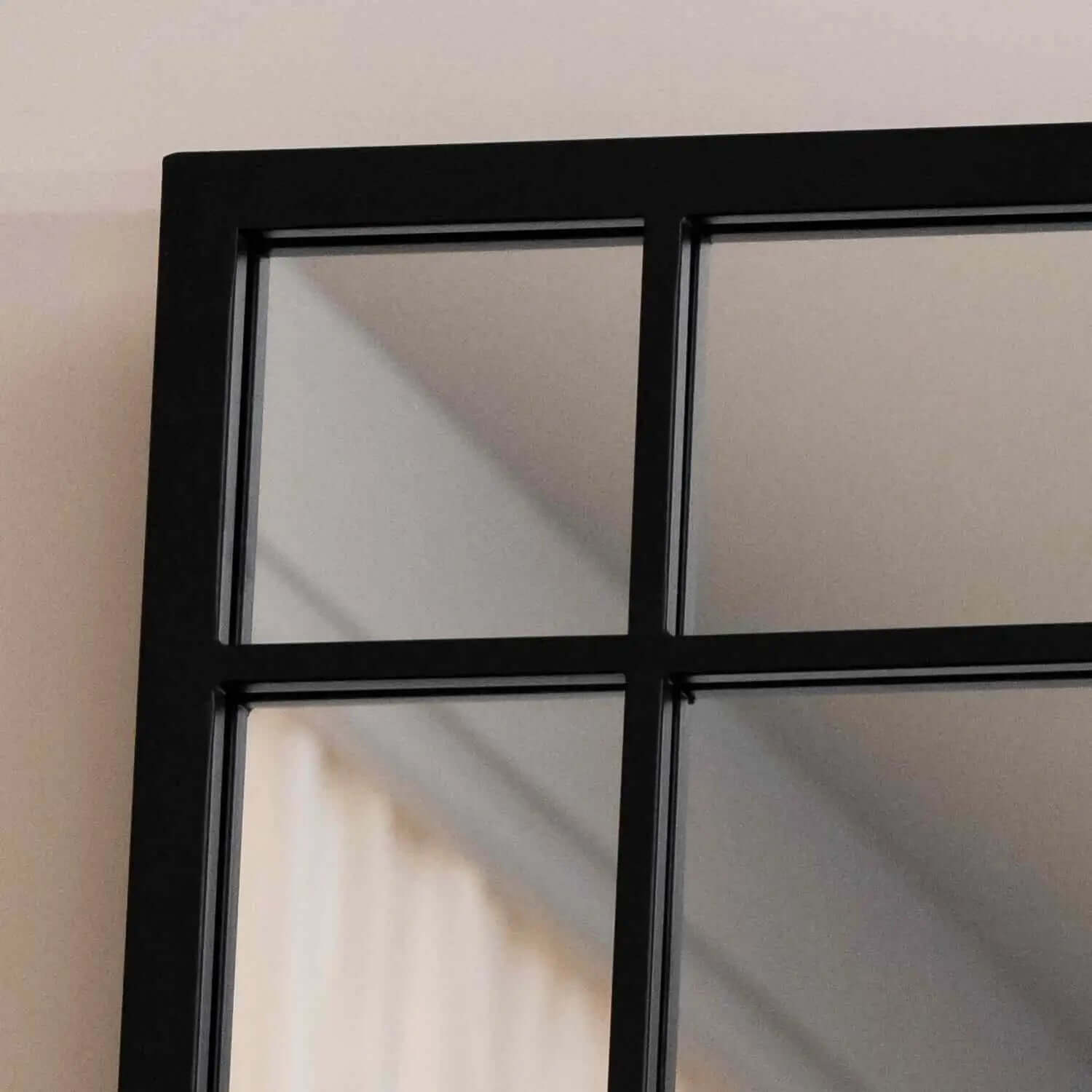 Black-framed window pane with multiple glass sections.