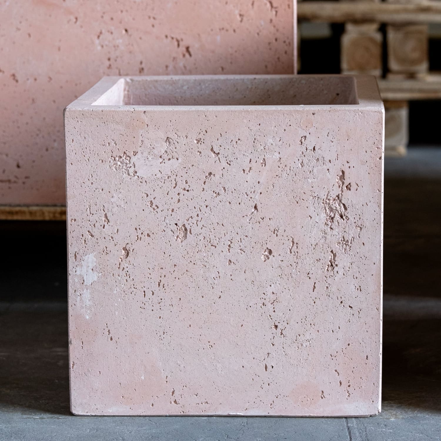 Square, textured, pinkish planter.