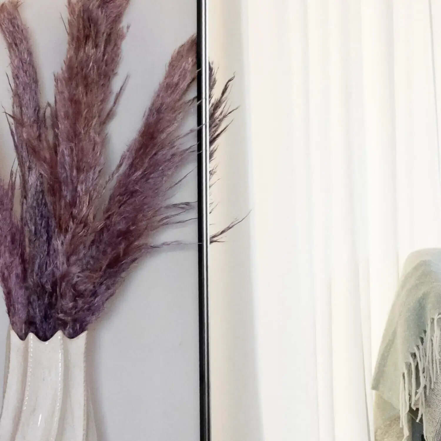 Purple pampas grass plume in a vase.