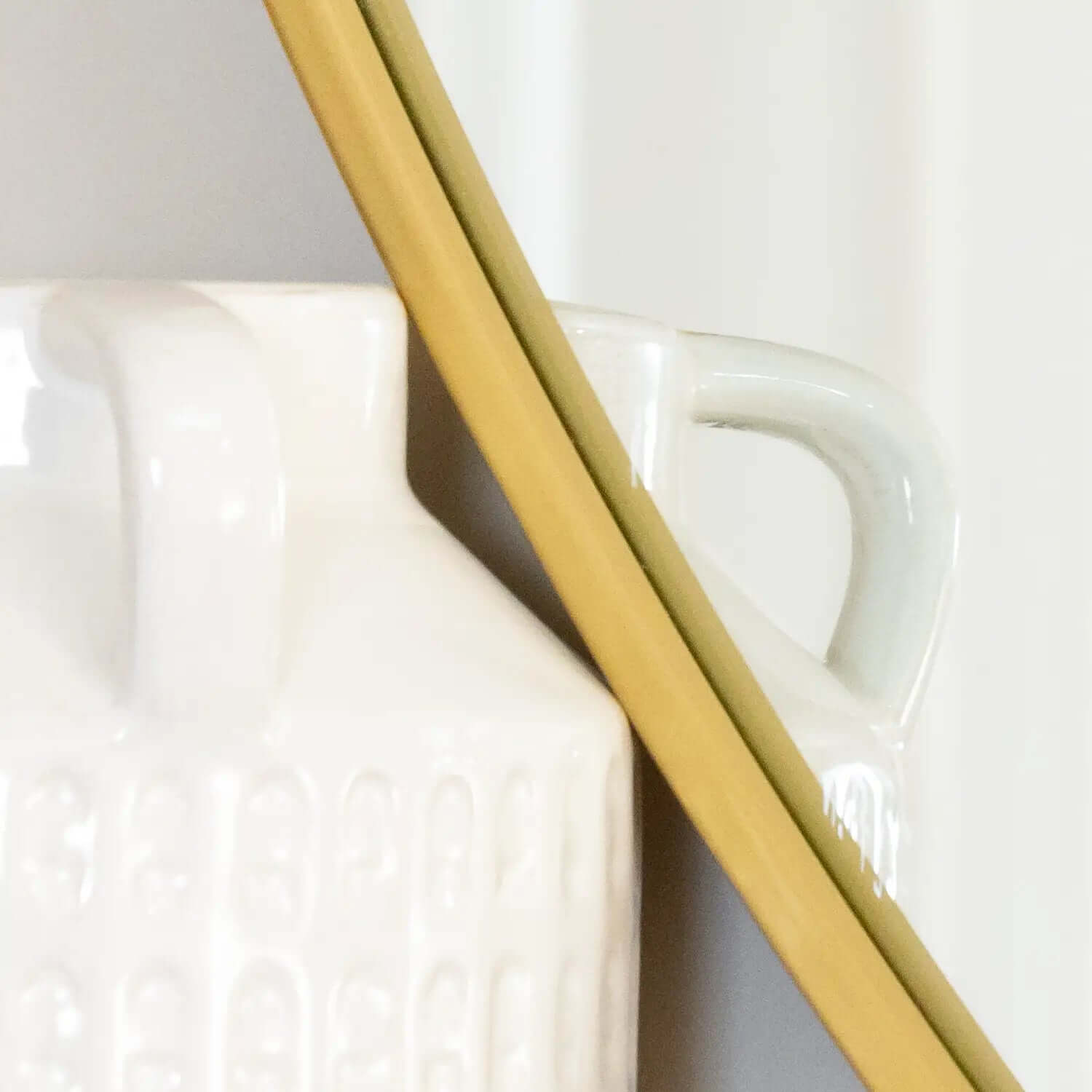 White ceramic mug with a handle.