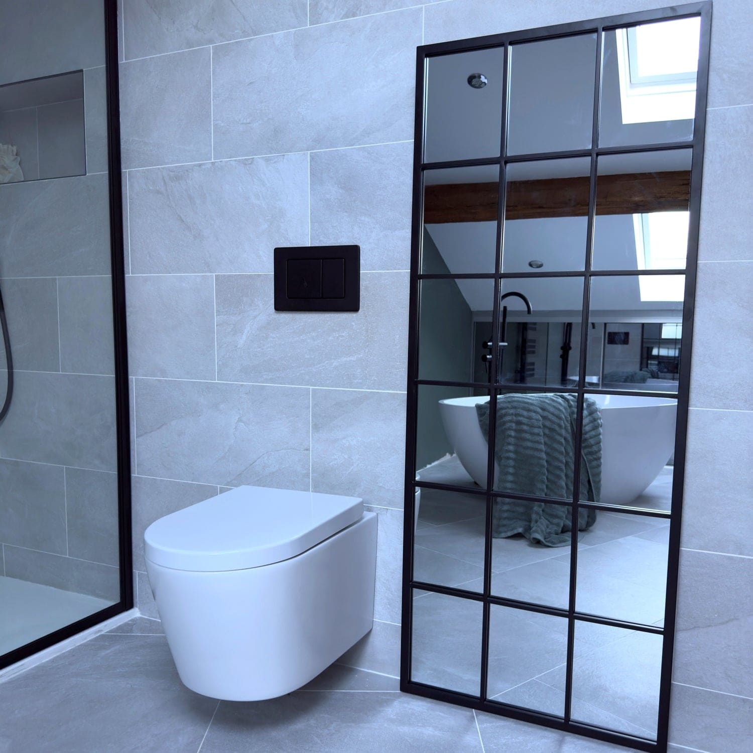 Modern wall-mounted white toilet with a minimalist design.