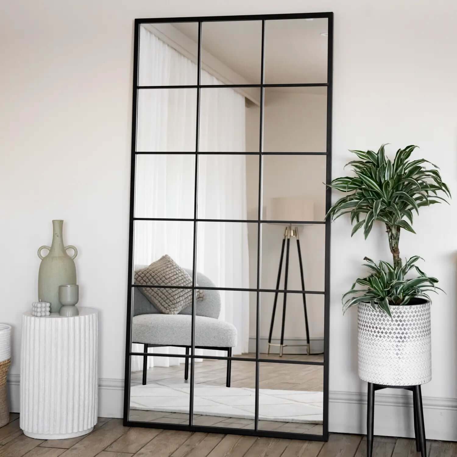 Black-framed grid mirror with rectangular panels.