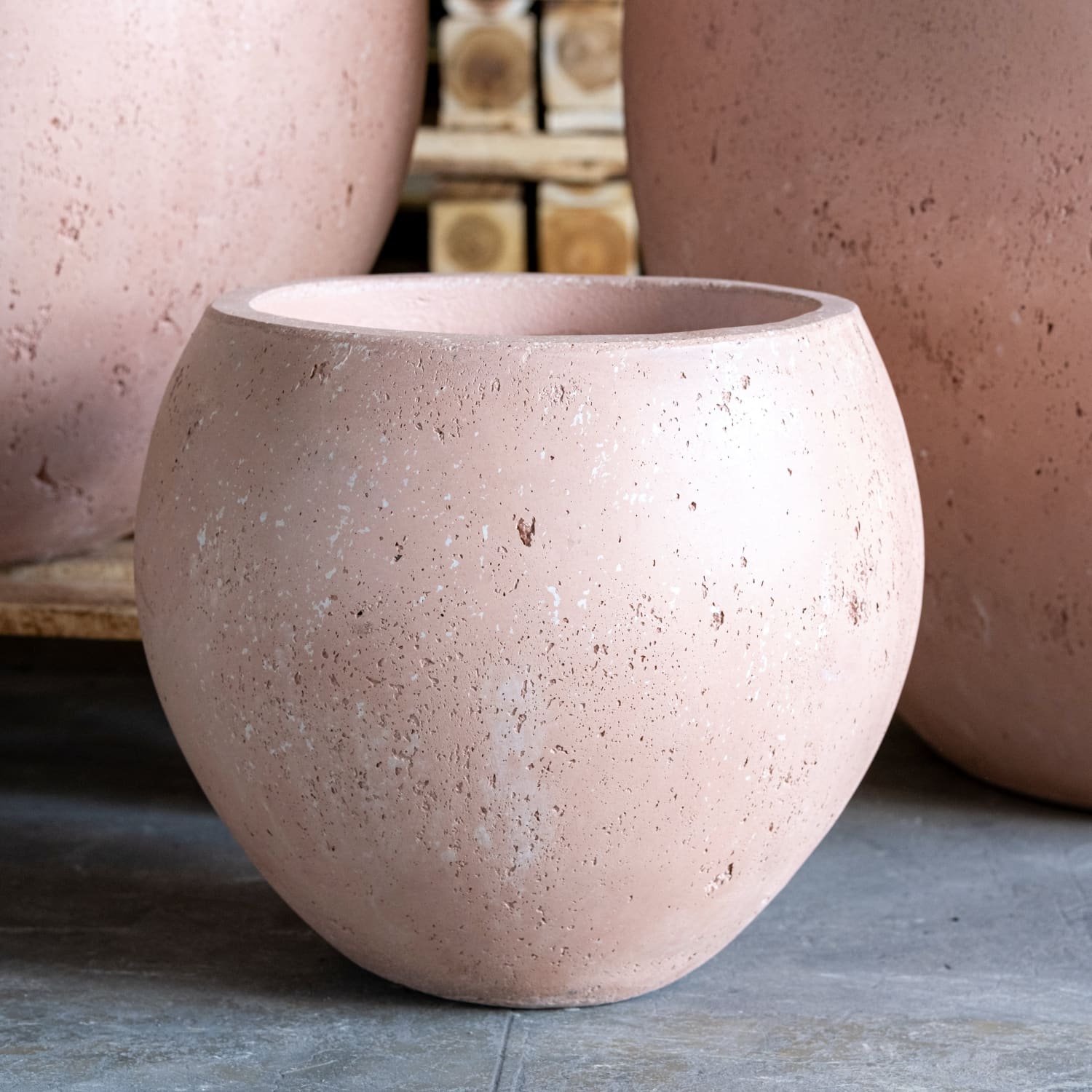 Round, pink, speckled planter.