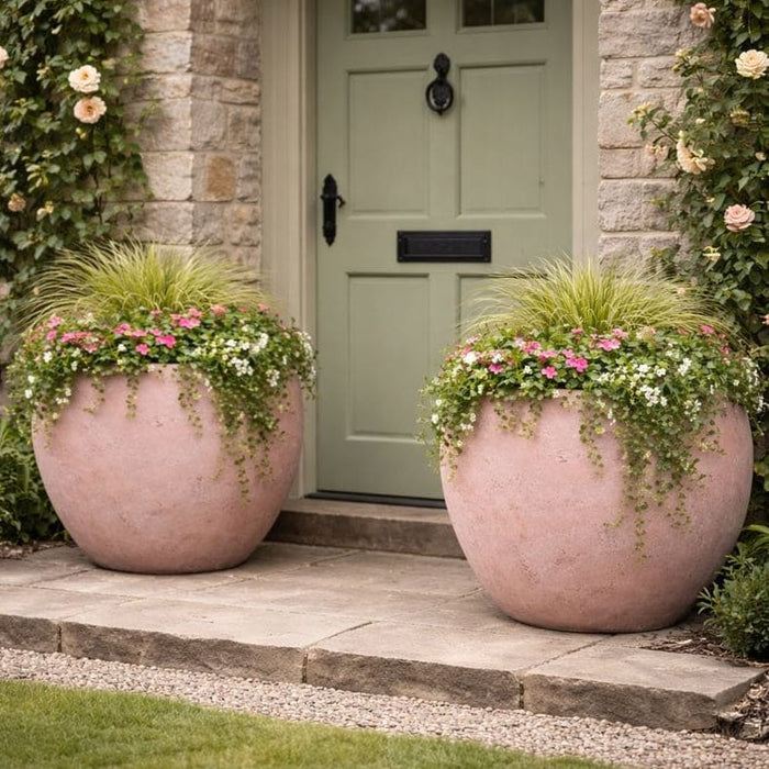Large planters either side of entrance door