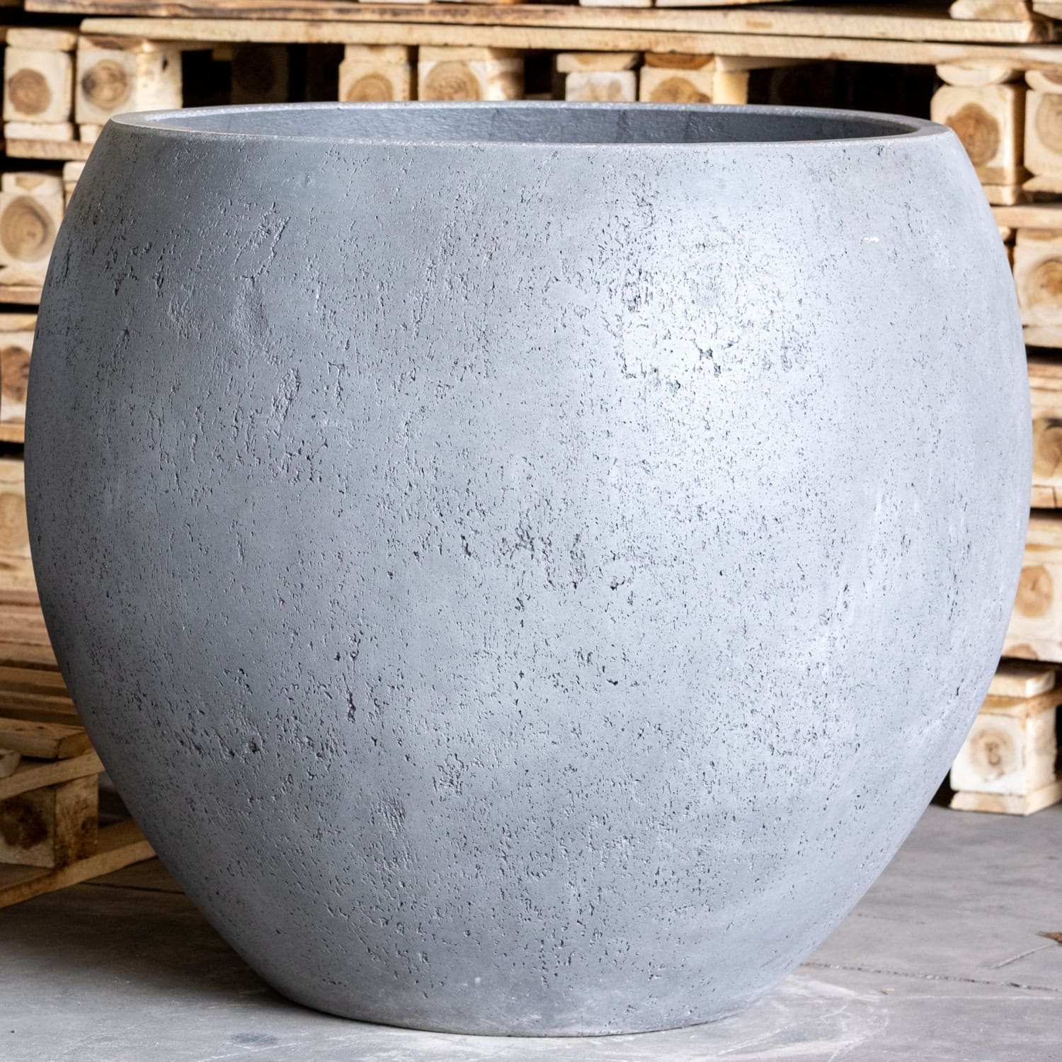Round, gray, textured planter.