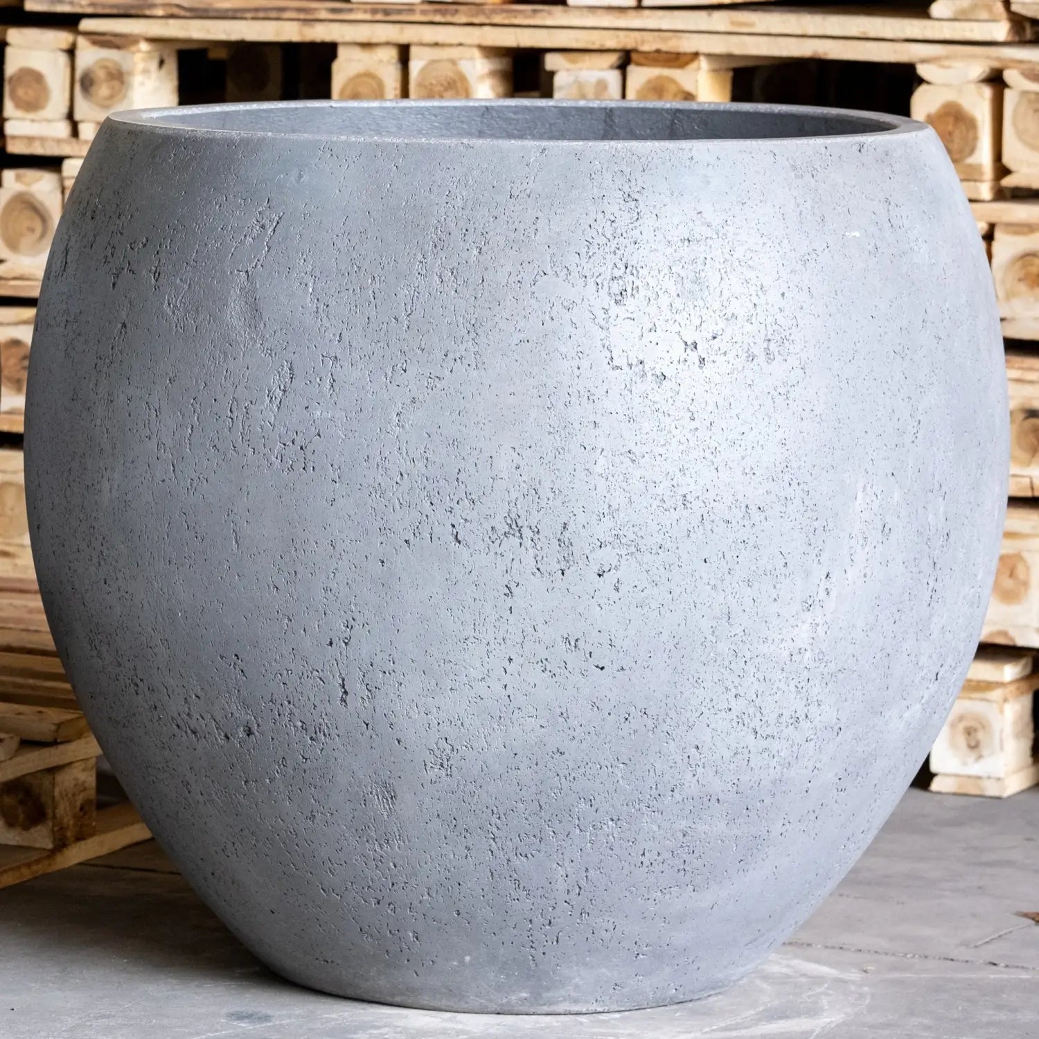 Round, gray, textured planter.