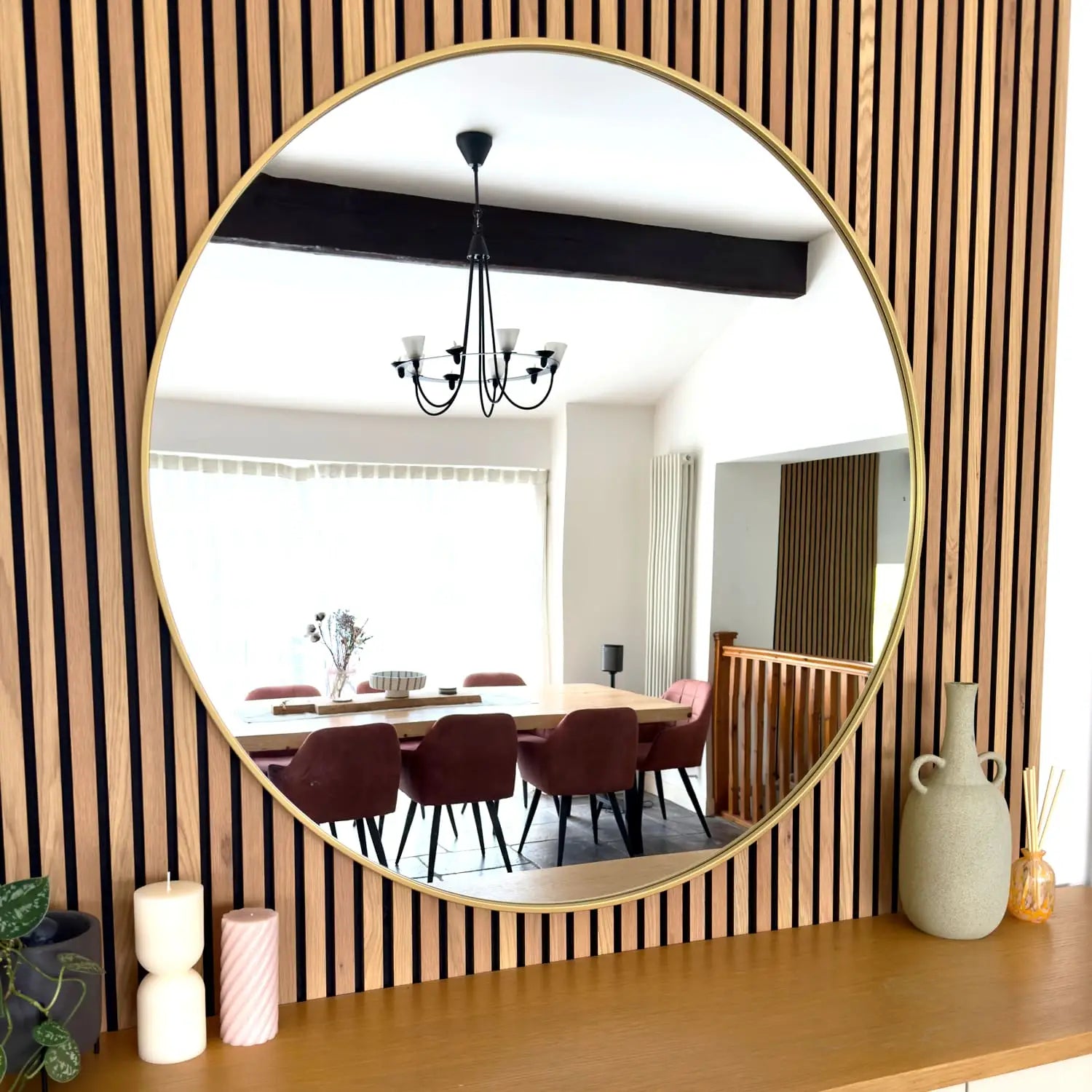 Rei 120cm gold circular mirror styled in a modern interior