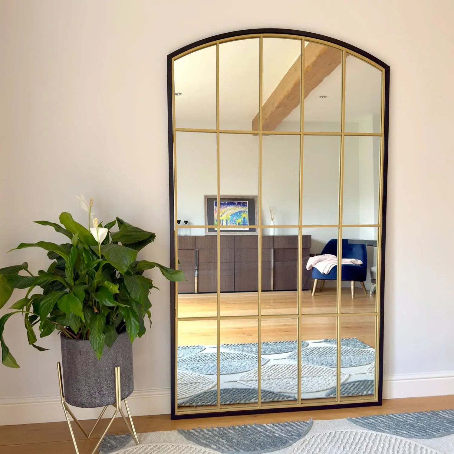 Arched windowpane mirror.