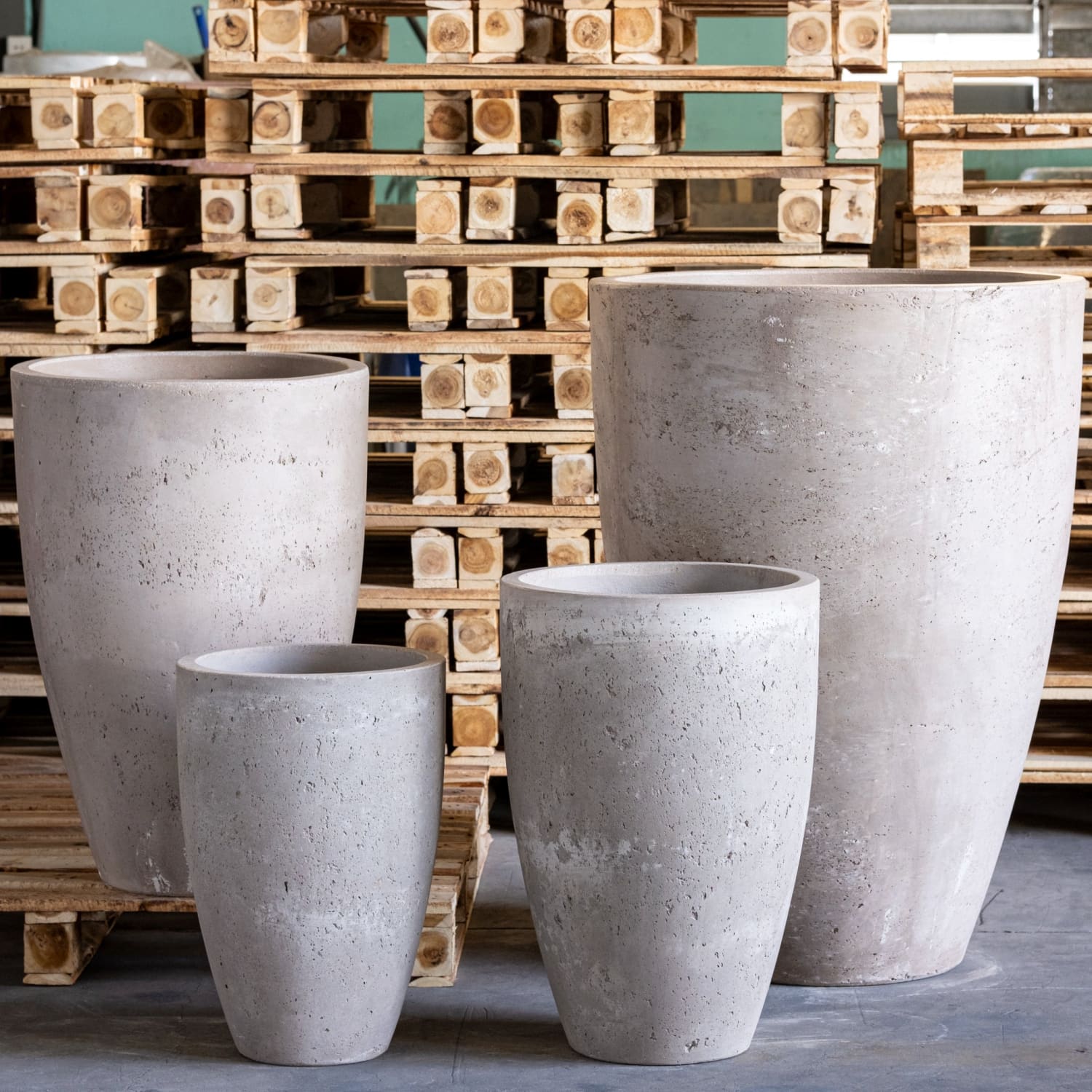 Four gray concrete planters.